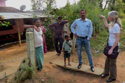 Taluk Health Officer Dr Kiran and social scientist Dr Gill Ainsworth talk to villagers about how the risk of KFD affects the way they use the forest - photo by Sarah Burthe